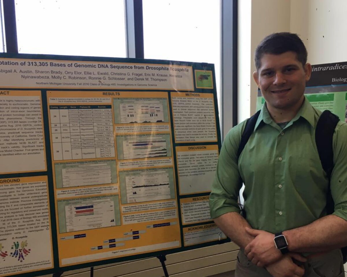 Orry Elor presenting a genomics research poster at Northern Michigan University