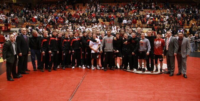 Orry Elor with the Ohio State University wrestling team on the mat at a dual meet