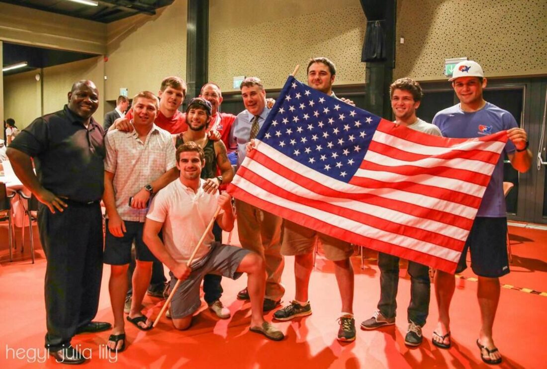 Orry Elor with the U.S. delegation and an American flag at the 2014 University World Championships in Pécs, Hungary